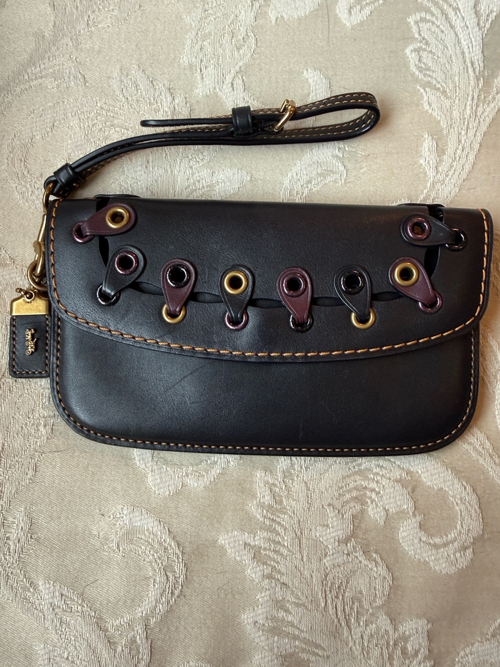 1941 Coach Black Leather Wristlet with Oxblood Gold Eyelet Detail